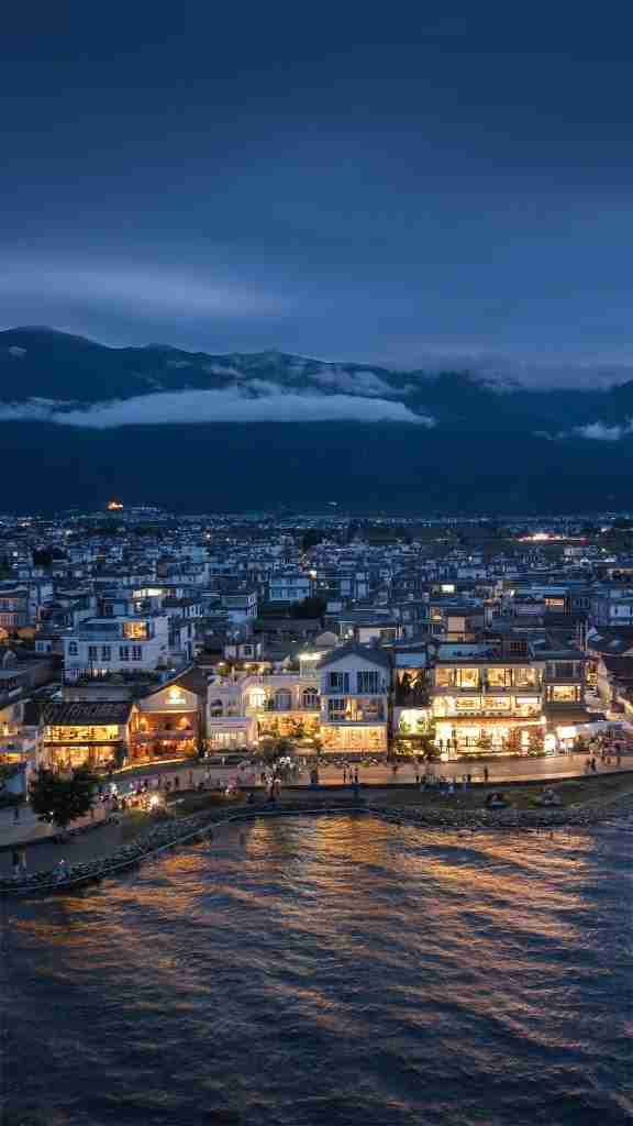 Dali lakeside town and Cangshan at winter blue hour, Erhai Lake, Yunnan